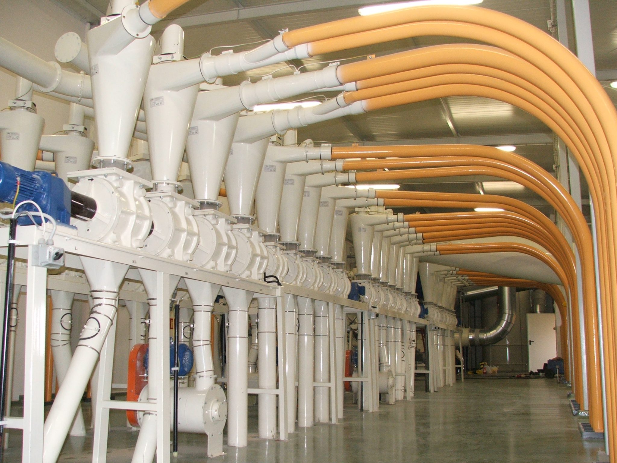 MACHINES FOR PNEUMATIC CONVEYING USING POSITIVE AND NEGATIVE DISPLACEMENT